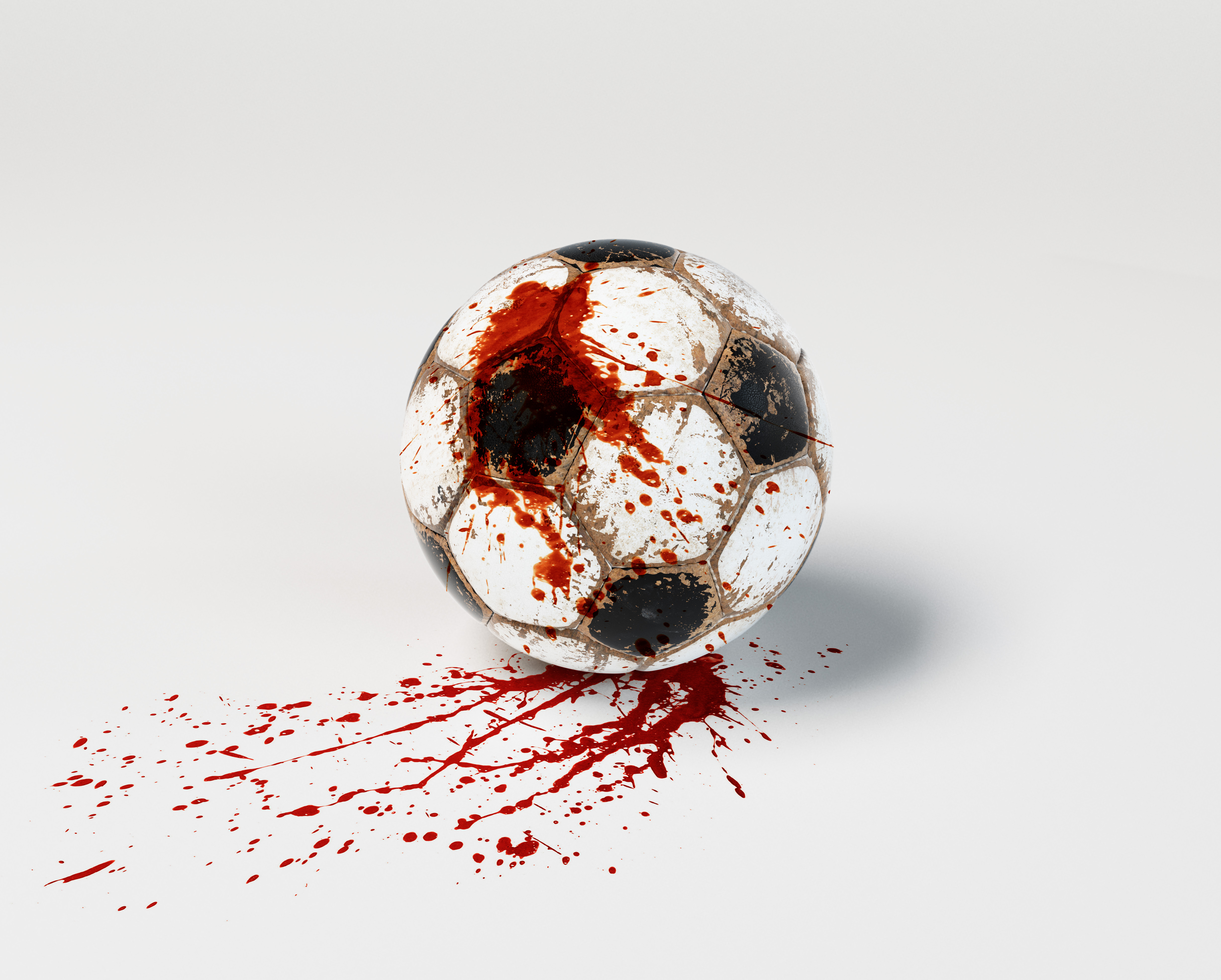 A old football cover with blood, fotboll med blod